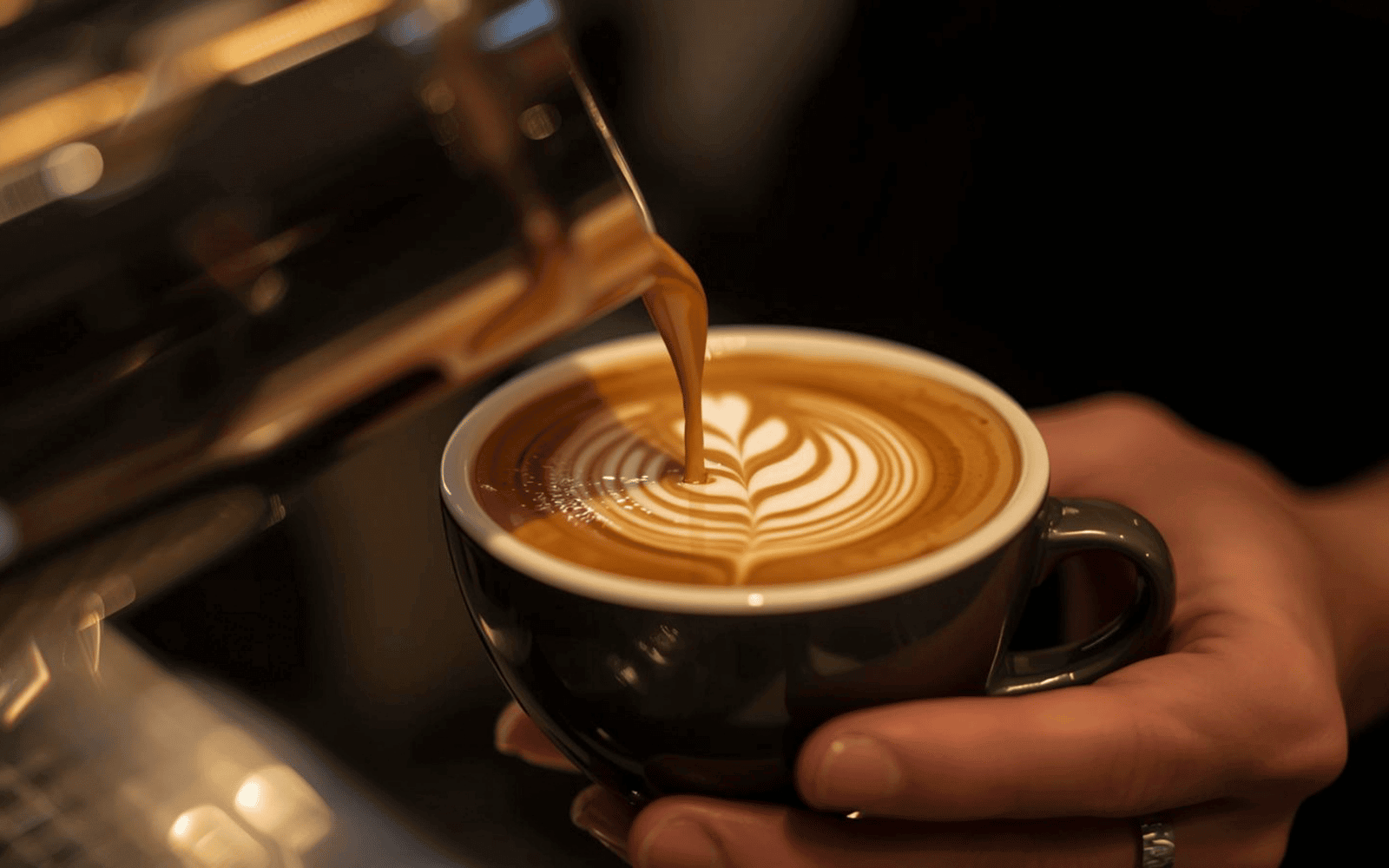 Barista pouring a latte